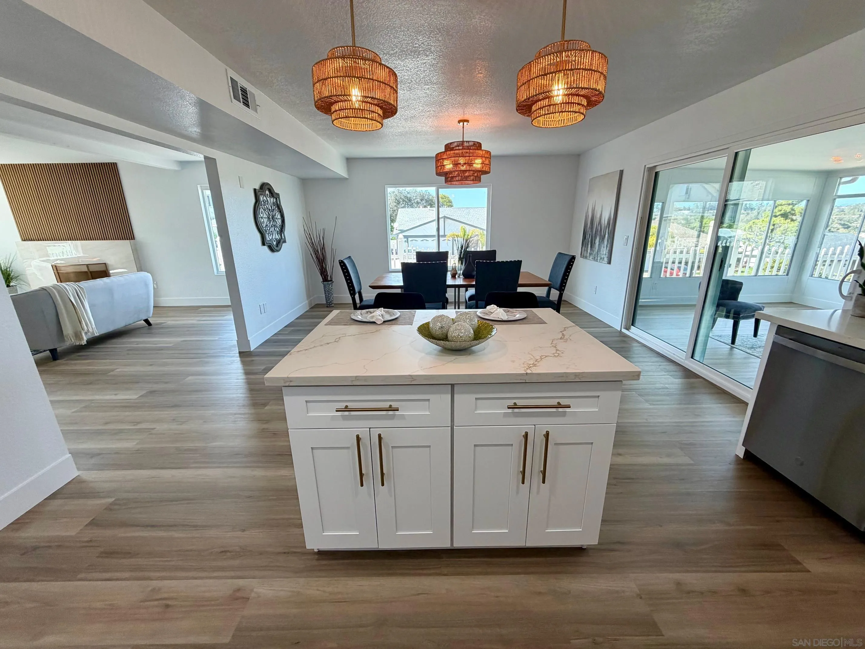 4128 Terry Street Oceanside, CA 92056 - Photo 4 of 21 a view of a kitchen area with furniture and wooden floor