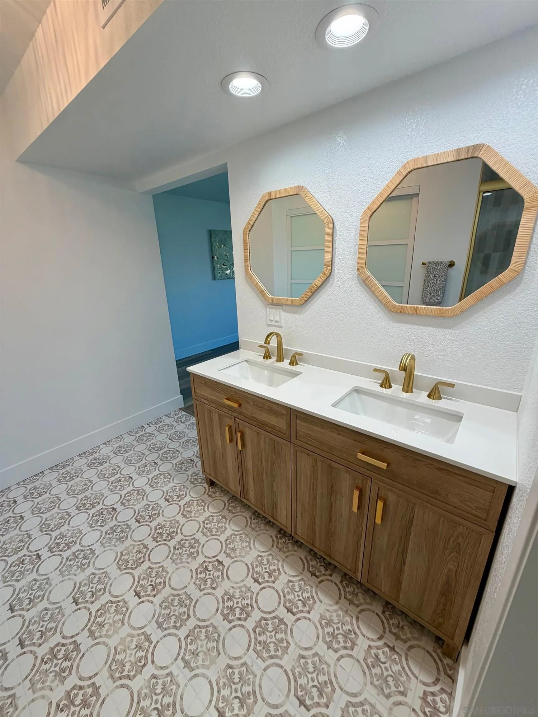 4128 Terry Street Oceanside, CA 92056 - Photo 9 of 21 a bathroom with a double vanity sink mirror and