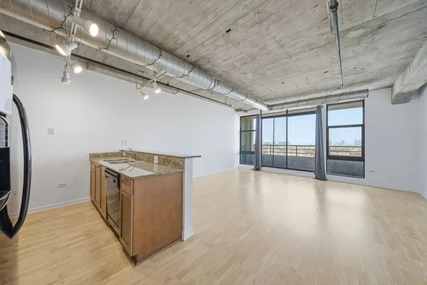 a kitchen that has a sink and a stove