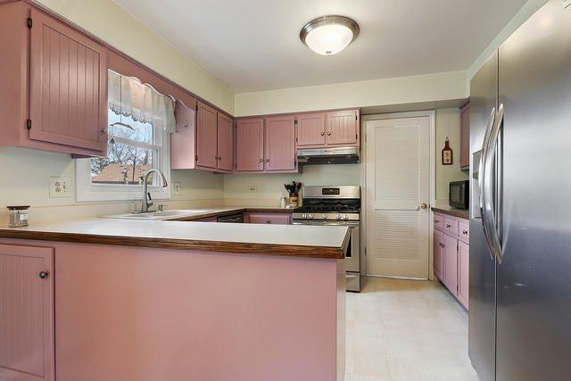 3490 Ronald Road Crete, IL 60417 - Photo 14 of 25 a kitchen with stainless steel appliances granite countertop a sink stove and refrigerator
