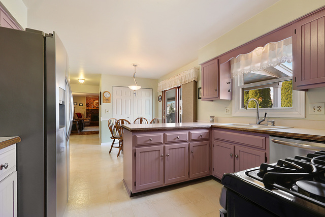 3490 Ronald Road Crete, IL 60417 - Photo 15 of 25 a kitchen with stainless steel appliances a sink a stove and a refrigerator