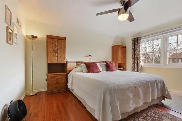 3490 Ronald Road Crete, IL 60417 - Photo 21 of 25 a bedroom with a bed and wooden floor