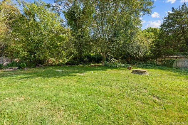 a view of outdoor space with deck and yard