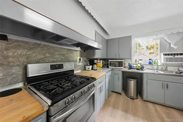 a kitchen with a stove and a sink