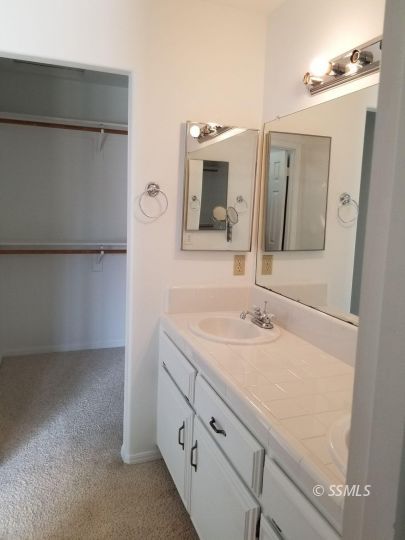 309 Petris Avenue Ridgecrest, CA 93555 - Photo 11 of 19 a bathroom with a sink and a mirror