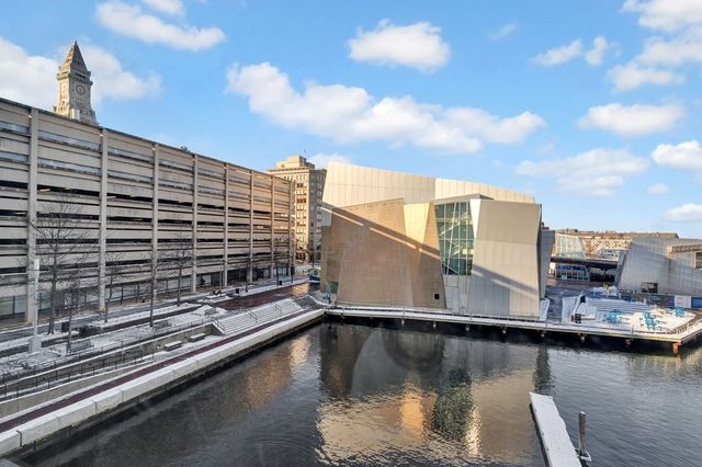 a view of a park with large trees