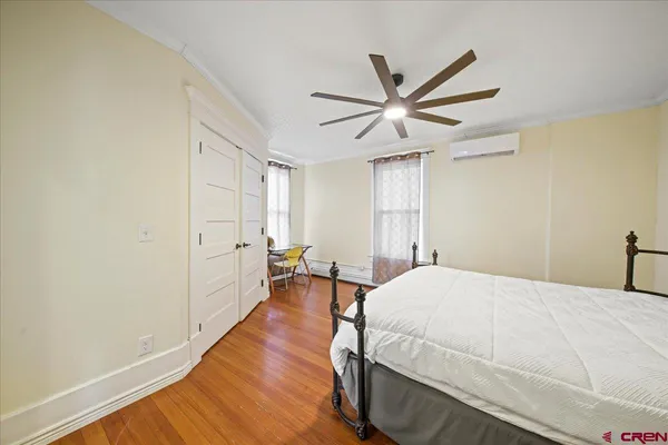 a bed room with a bed and a window