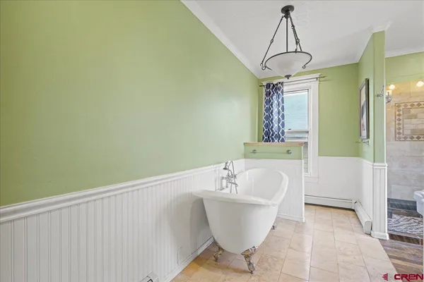 a bathroom with a bathtub and shower