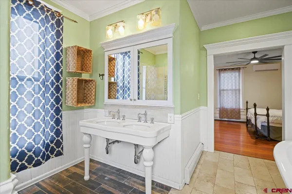 a spacious bathroom with a sink and a mirror