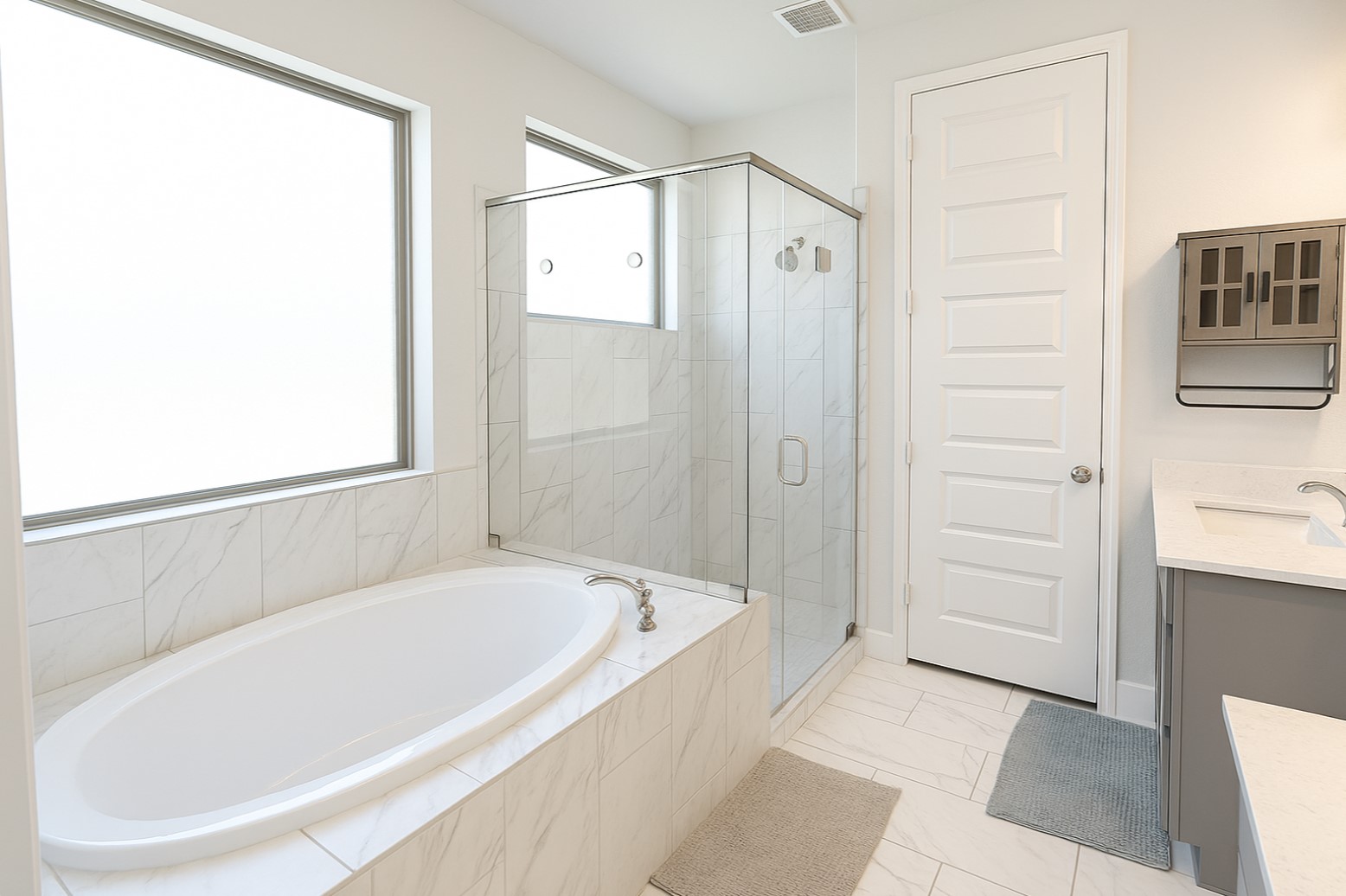 284 Kimble Creek Loop Kyle, TX 78640 - Photo 7 of 37 Full bathroom featuring vanity, a garden tub, and a shower stall