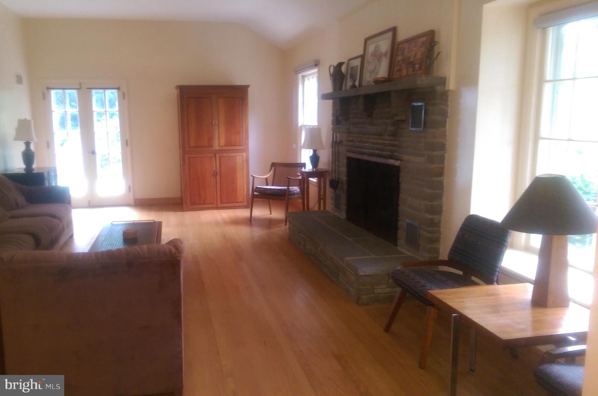 1922 Norvale Road Silver Spring, MD 20906 - Photo 7 of 30 Living Room with French doors and fireplace