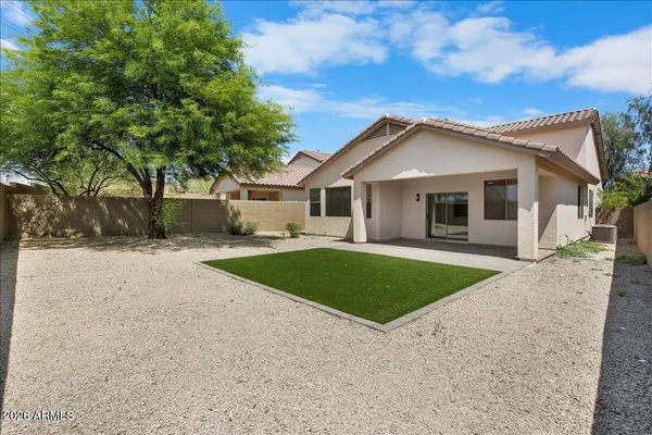 a front view of a house with garage and yard
