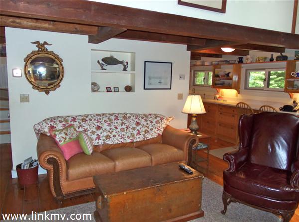 84 Pennywise Path Edgartown, MA 02539 - Photo 18 of 29 a living room with furniture and a chandelier