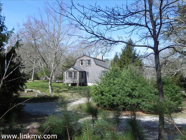 84 Pennywise Path Edgartown, MA 02539 - Photo 2 of 29 a view of house in front of a big yard with plants and large trees