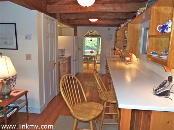 84 Pennywise Path Edgartown, MA 02539 - Photo 21 of 29 a view of a hallway with furniture and a livingroom
