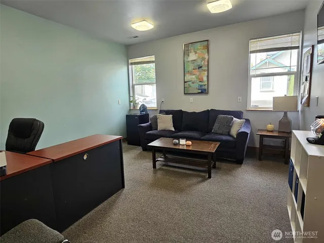 a living room with furniture and a window