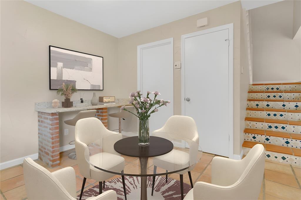 5286 Willow Court, Unit 505 Orlando, FL 32811 - Photo 12 of 33 a dining room with furniture and wooden floor