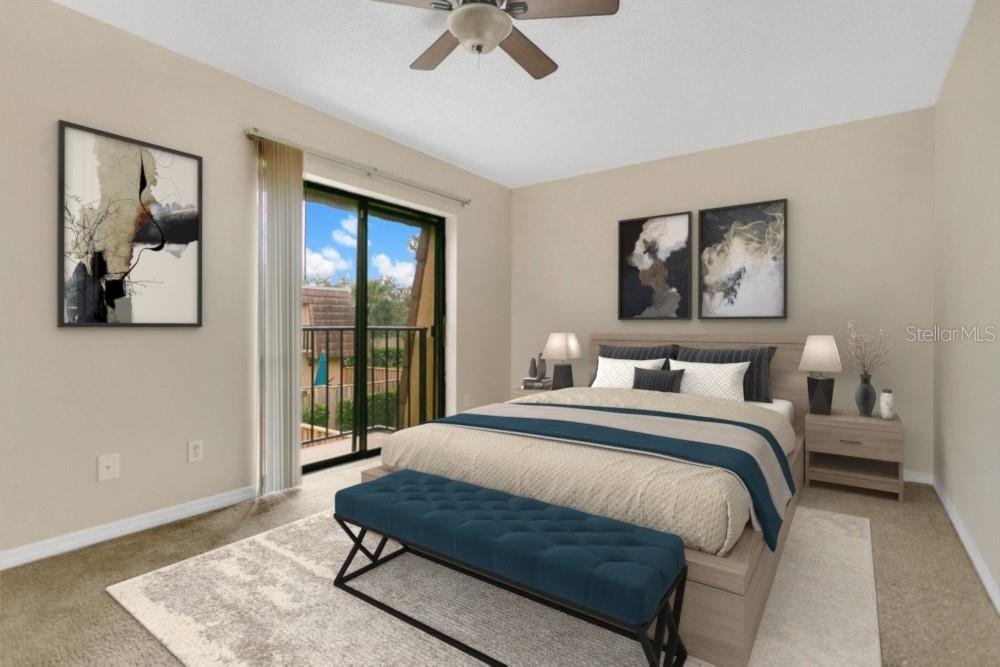 5286 Willow Court, Unit 505 Orlando, FL 32811 - Photo 21 of 33 a bedroom with a bed and glass wall painting