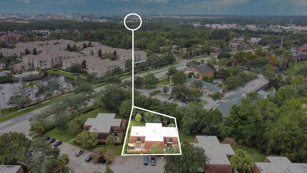 5286 Willow Court, Unit 505 Orlando, FL 32811 - Photo 28 of 33 an aerial view of house with a yard