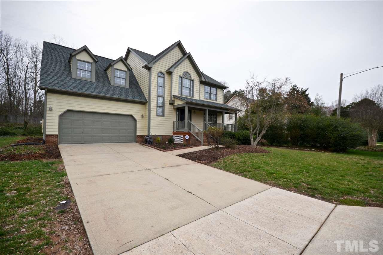 2341 Kendricks Court Raleigh, NC 27613 - Photo 2 of 29 a front view of a house with a yard and trees