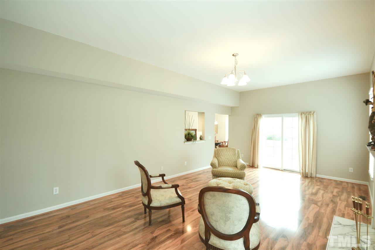 2341 Kendricks Court Raleigh, NC 27613 - Photo 14 of 29 a workspace room with wooden floor potted plant and windows