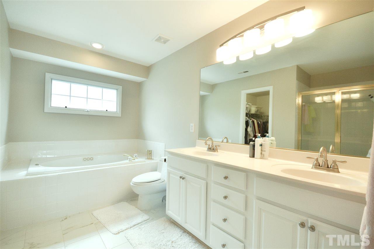 2341 Kendricks Court Raleigh, NC 27613 - Photo 18 of 29 a bathroom with a double vanity sink mirror and toilet