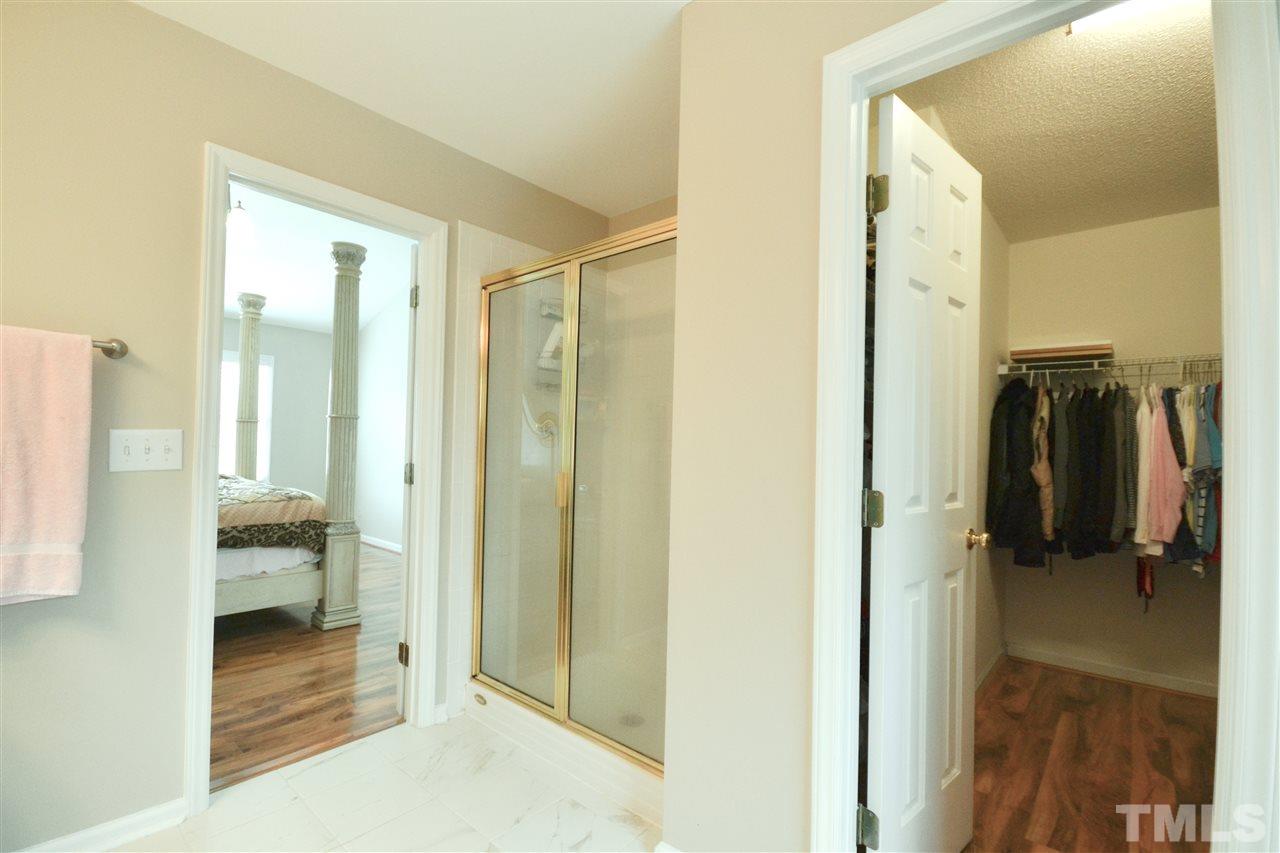 2341 Kendricks Court Raleigh, NC 27613 - Photo 19 of 29 a view of walk in closet with clothes
