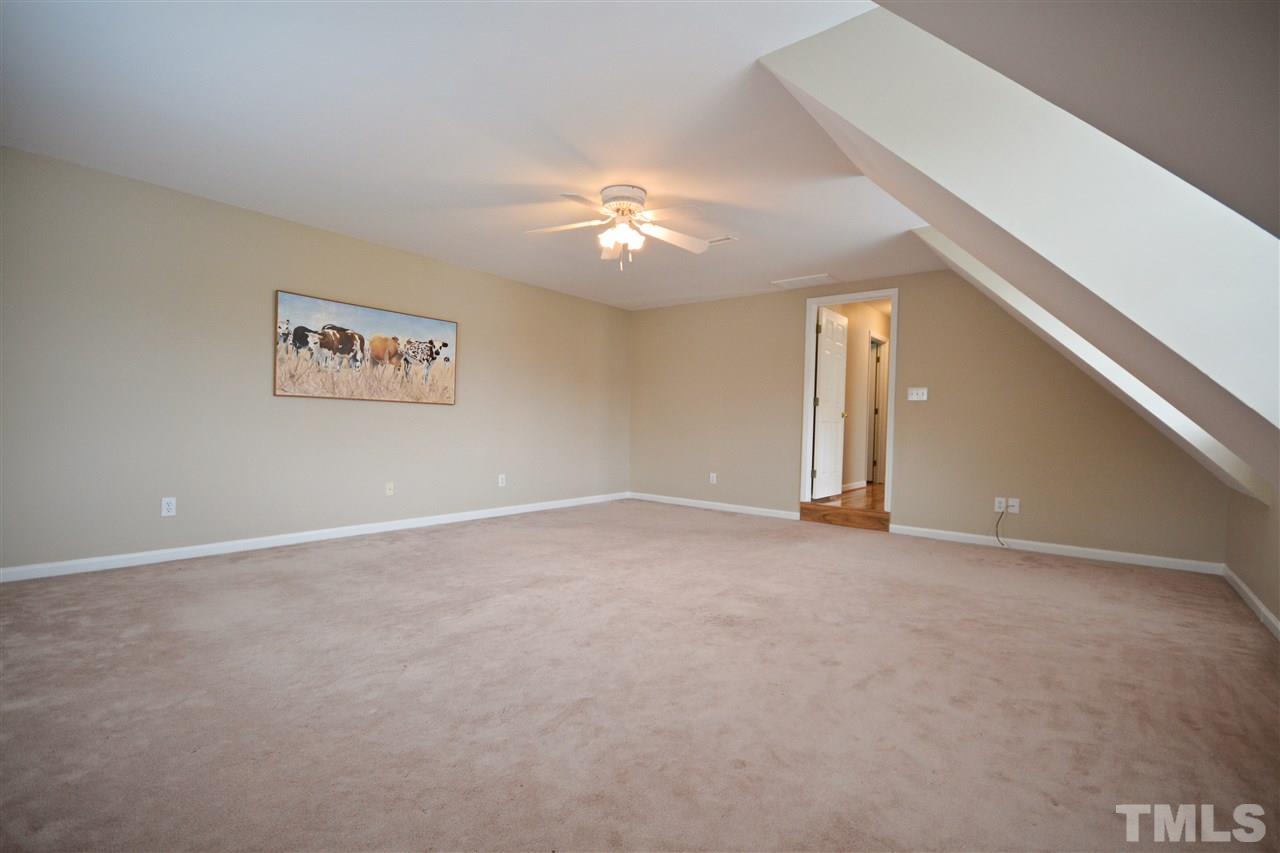 2341 Kendricks Court Raleigh, NC 27613 - Photo 26 of 29 a view of an empty room with a ceiling fan
