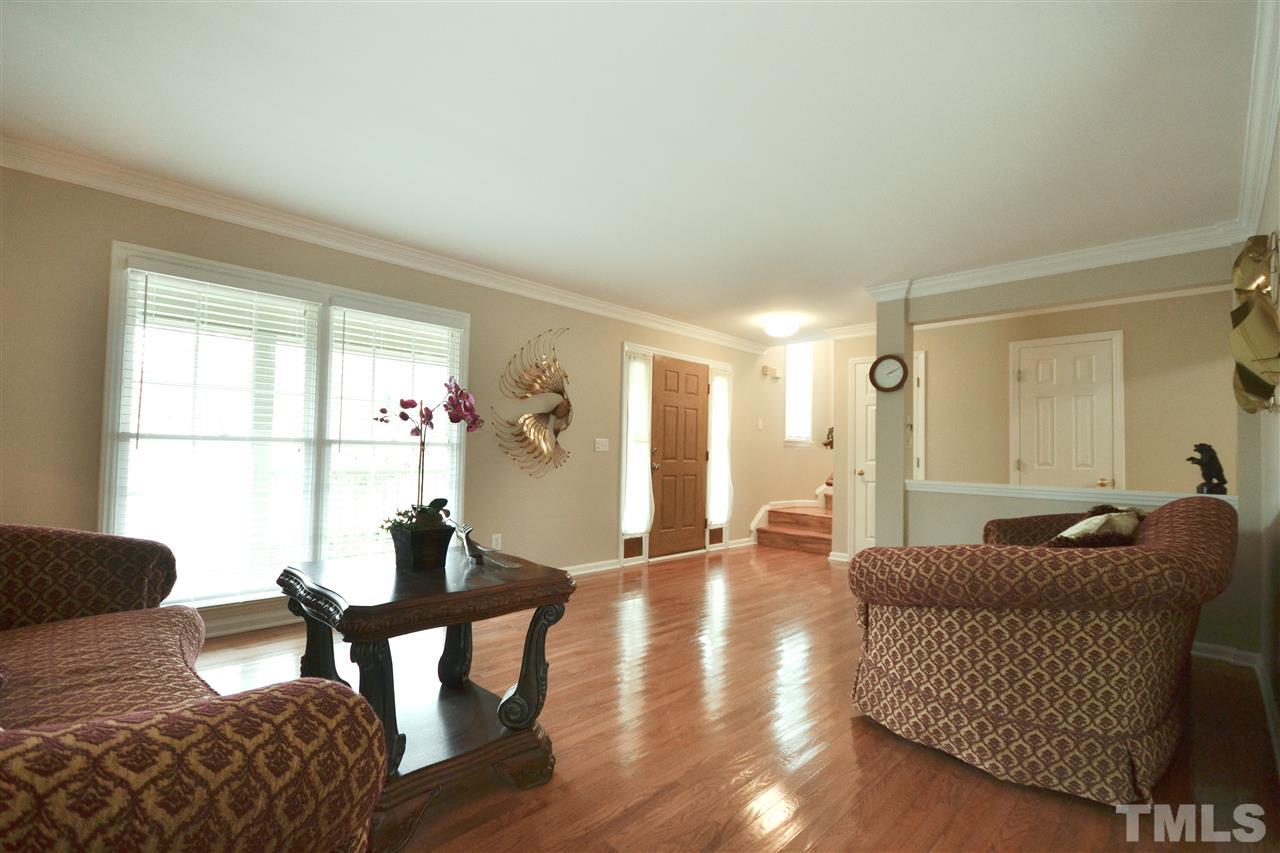 2341 Kendricks Court Raleigh, NC 27613 - Photo 6 of 29 a living room with furniture and a large window