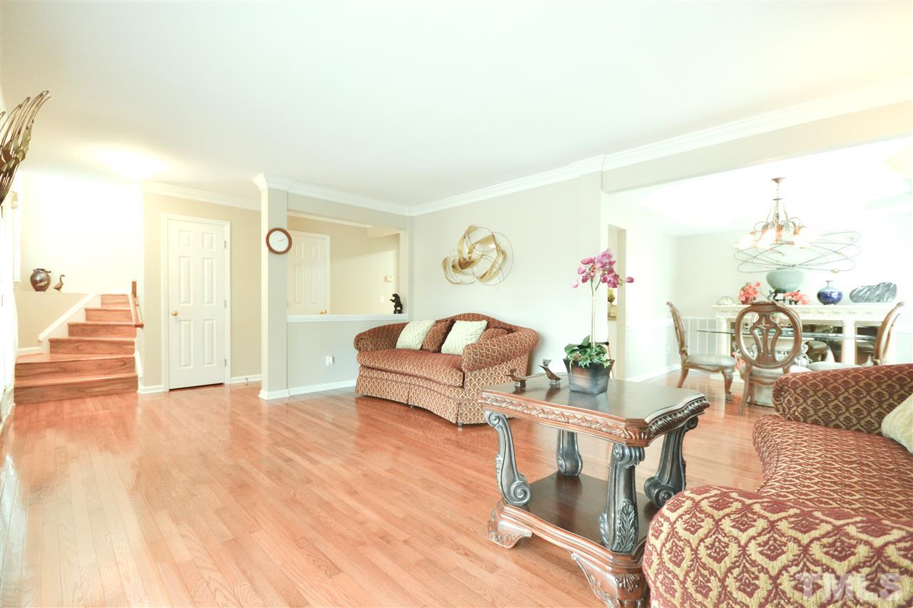 2341 Kendricks Court Raleigh, NC 27613 - Photo 7 of 29 a living room with furniture and wooden floor