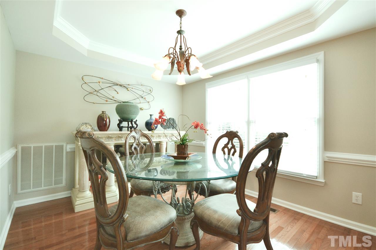 2341 Kendricks Court Raleigh, NC 27613 - Photo 8 of 29 a view of a dining room with furniture window and wooden floor