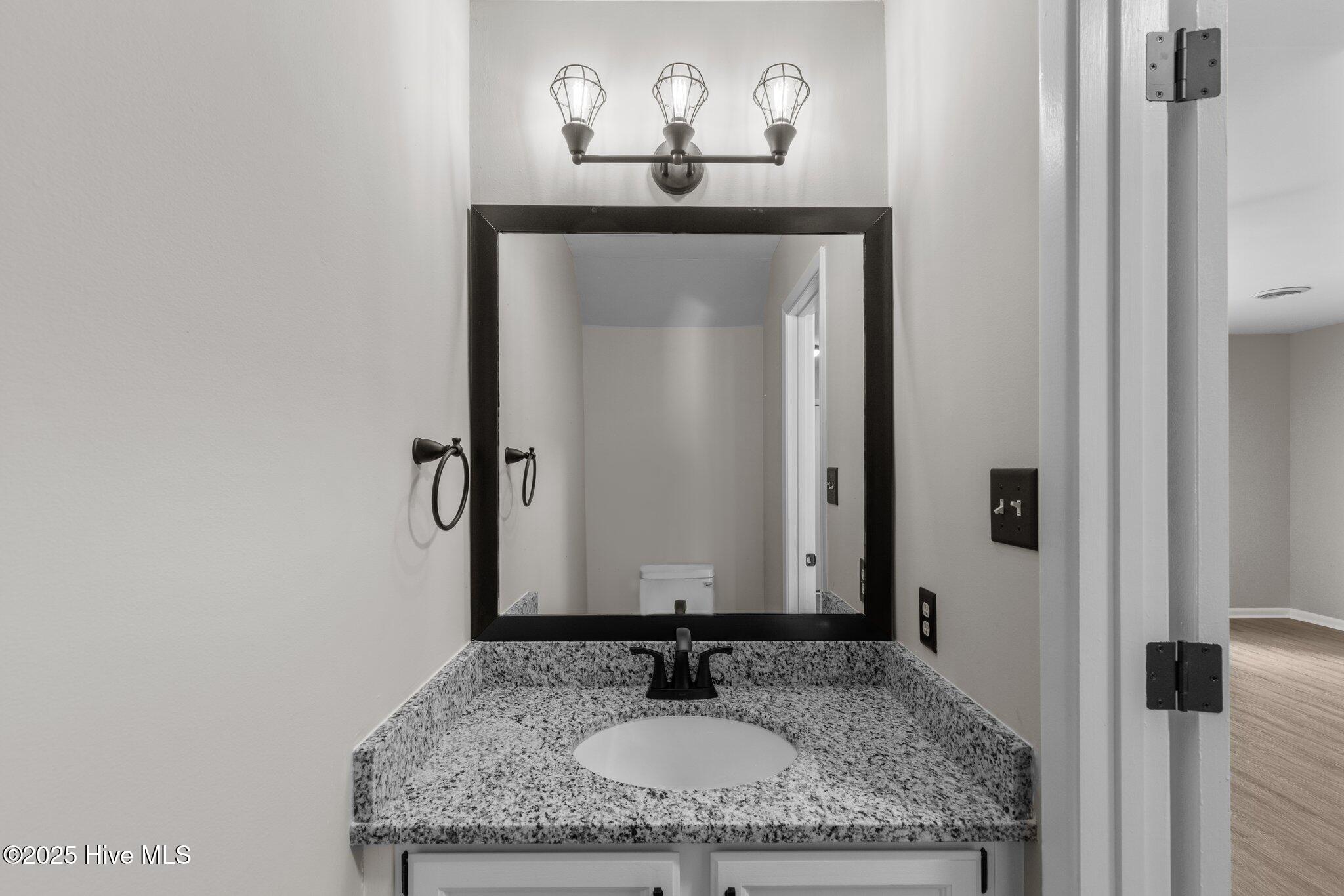 48 Port W Court, Unit D Swansboro, NC 28584 - Photo 12 of 33 1/2 bath on first floor