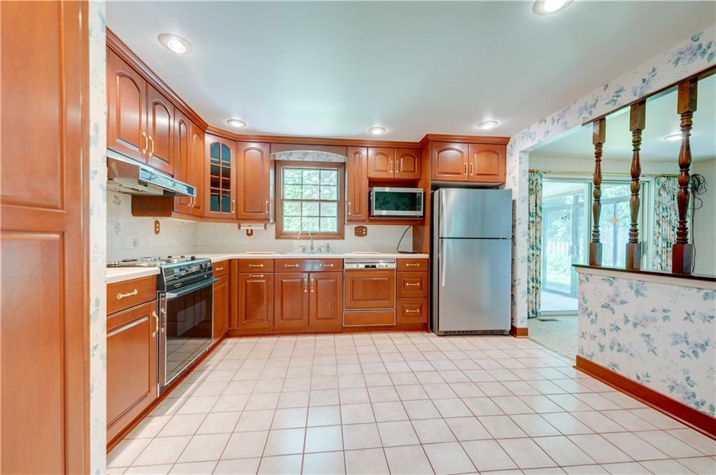 207 Baintree Road Coraopolis, PA 15108 - Photo 5 of 25 Updated eat in kitchen - with cherry cabinets and recessed lighting