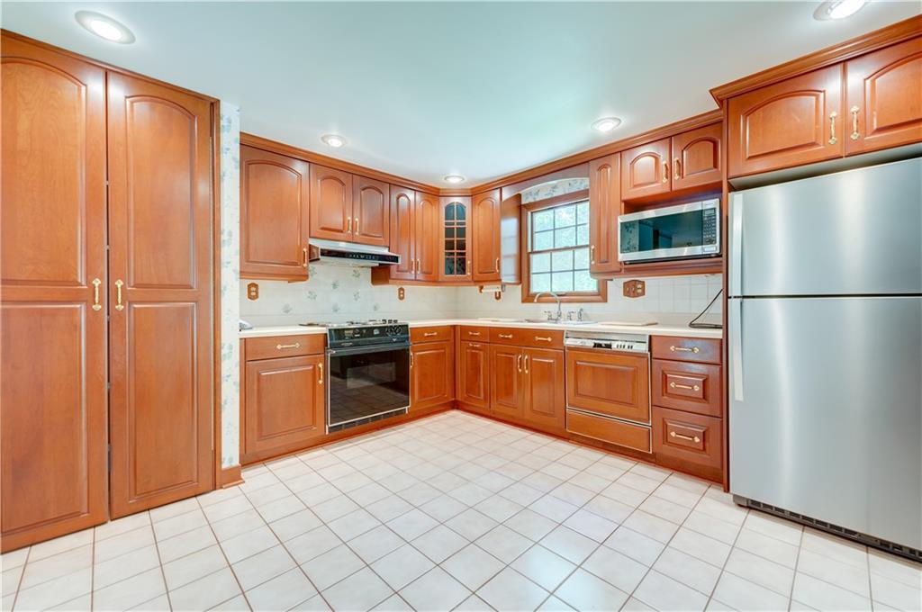 207 Baintree Road Coraopolis, PA 15108 - Photo 6 of 25 Updated eat in kitchen with large pantry and new SS refrigerator.