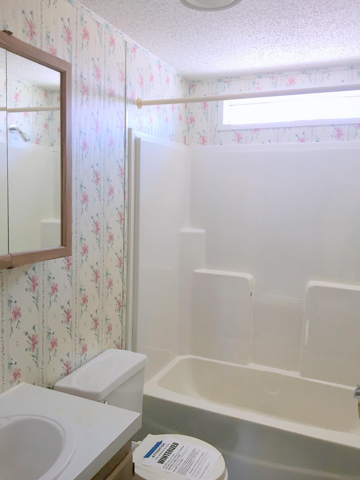 882 Don Graff Road Freeport, FL 32439 - Photo 11 of 22 a bathroom with a bathtub and a shower