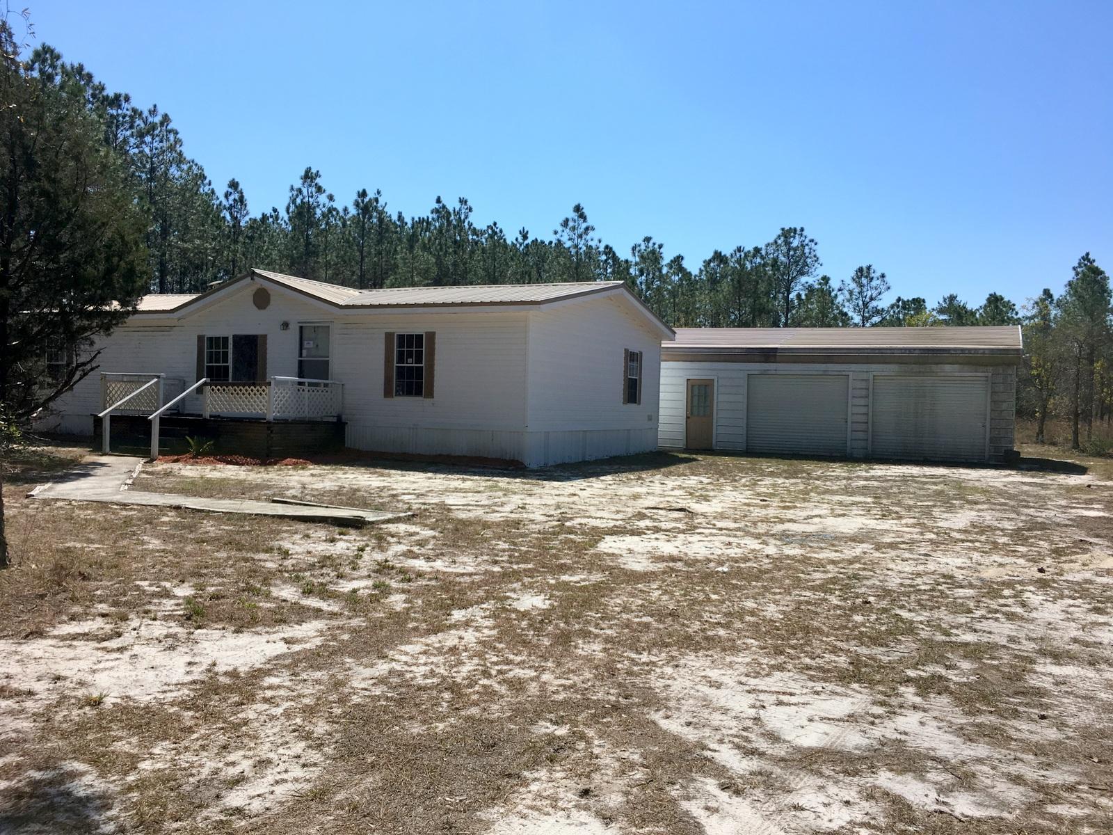 882 Don Graff Road Freeport, FL 32439 - Photo 15 of 22 a house view with a garden space