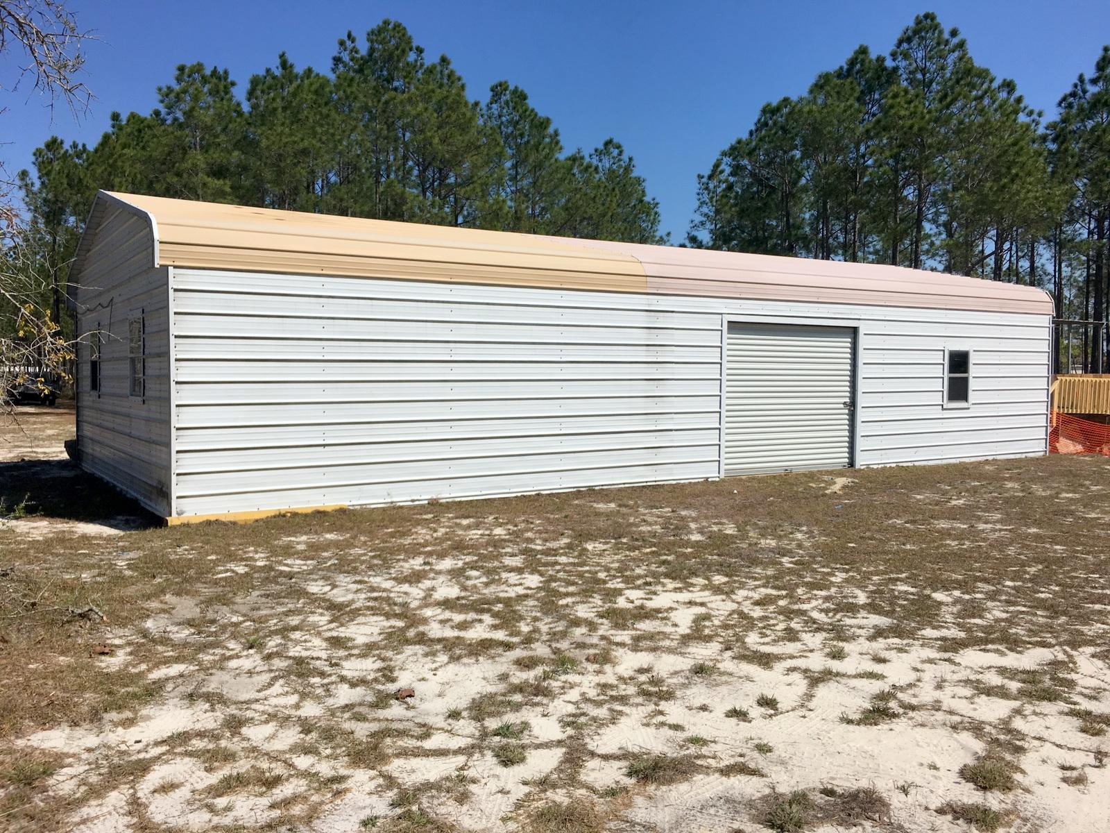 882 Don Graff Road Freeport, FL 32439 - Photo 17 of 22 a view of a backyard with a garden