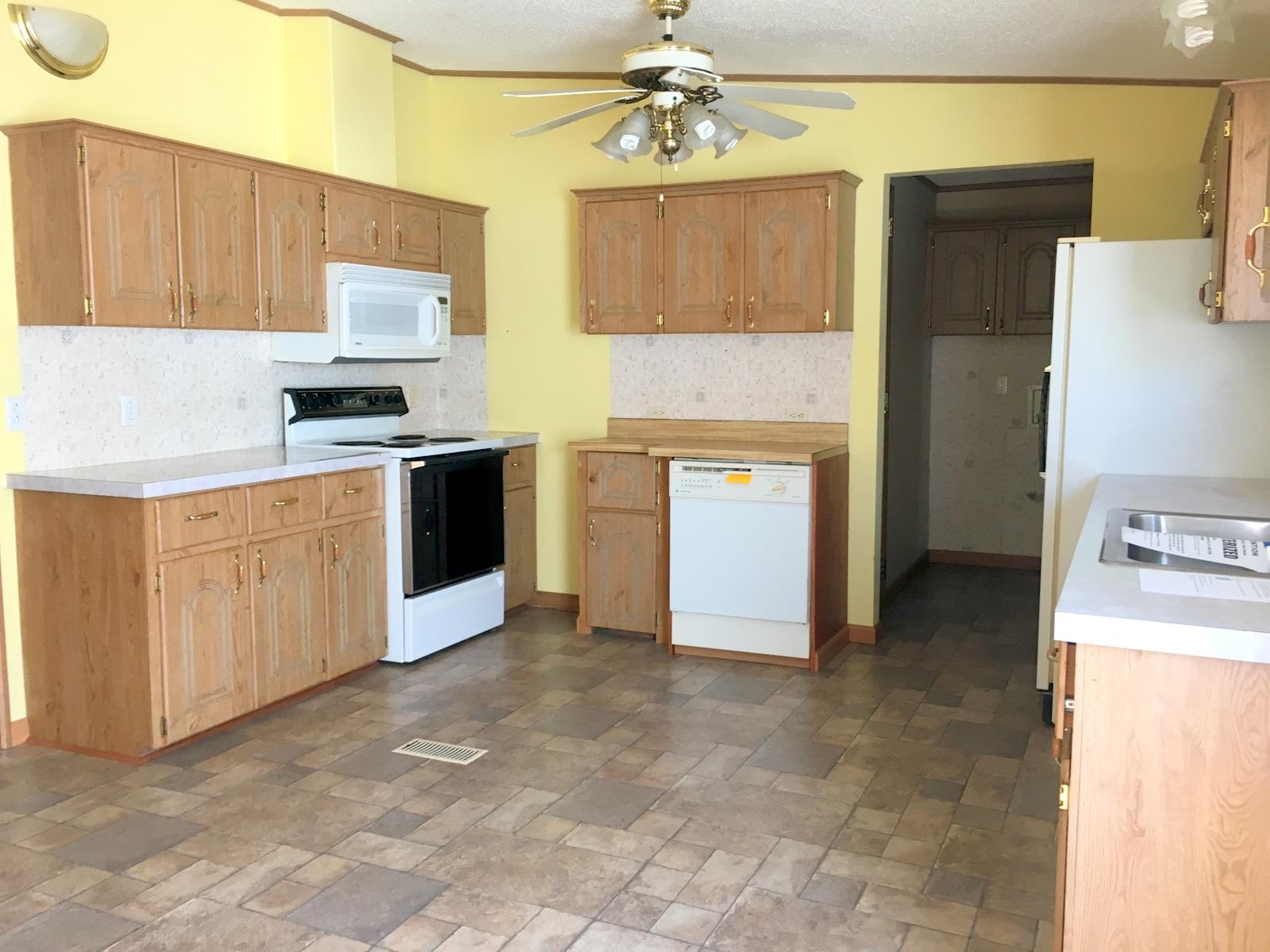 882 Don Graff Road Freeport, FL 32439 - Photo 4 of 22 a kitchen with stainless steel appliances a stove top oven a sink a refrigerator and cabinets
