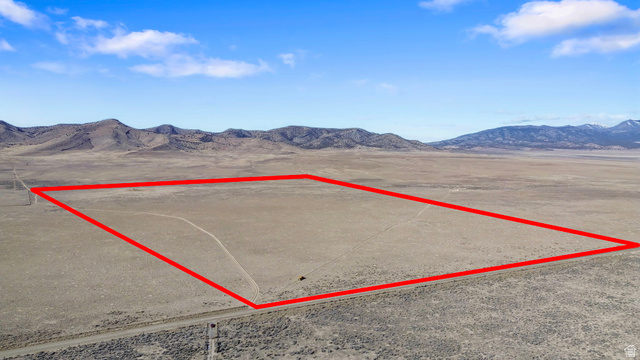 18150 South Allens Rnch Road West Cedar Valley, UT 84013 - Photo 1 of 15 Aerial overview of property's location featuring a mountain backdrop and property parcel outlined