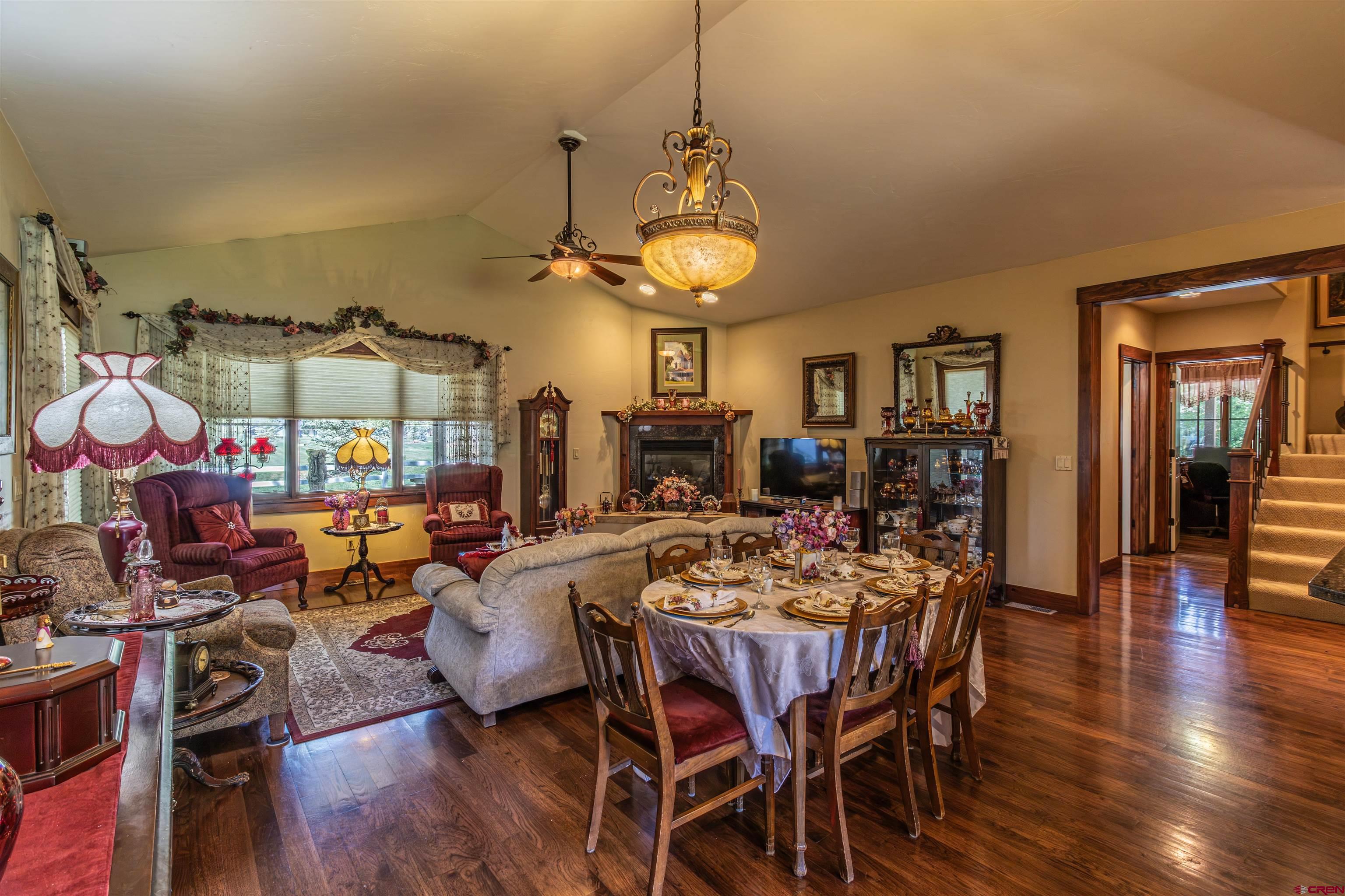 1167 North Dalton Ranch Road Durango, CO 81301 - Photo 7 of 45 a view of a dining room with furniture wooden floor and chandelier