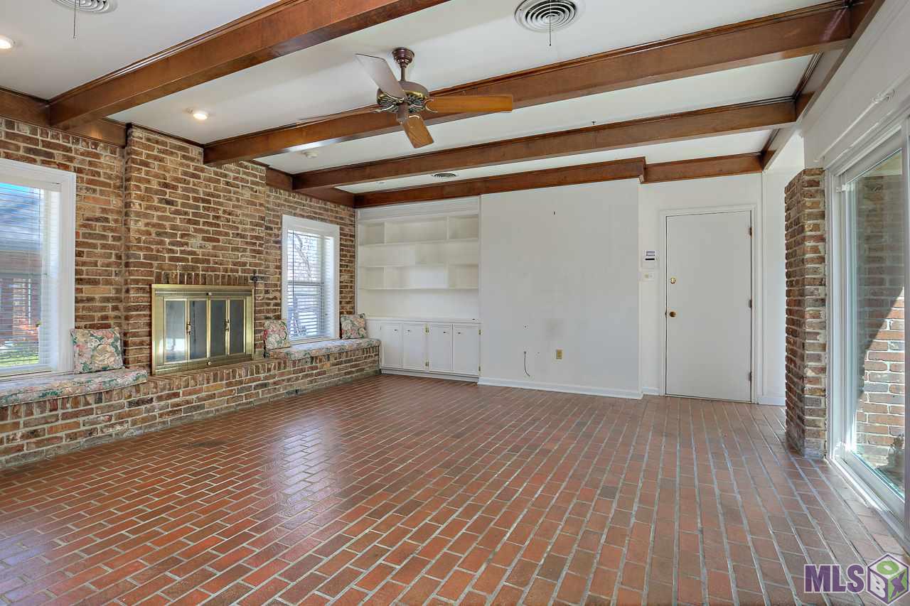 1235 Crescent Drive Baton Rouge, LA 70806 - Photo 9 of 25 Den has a Fireplace and Beamed Ceilings