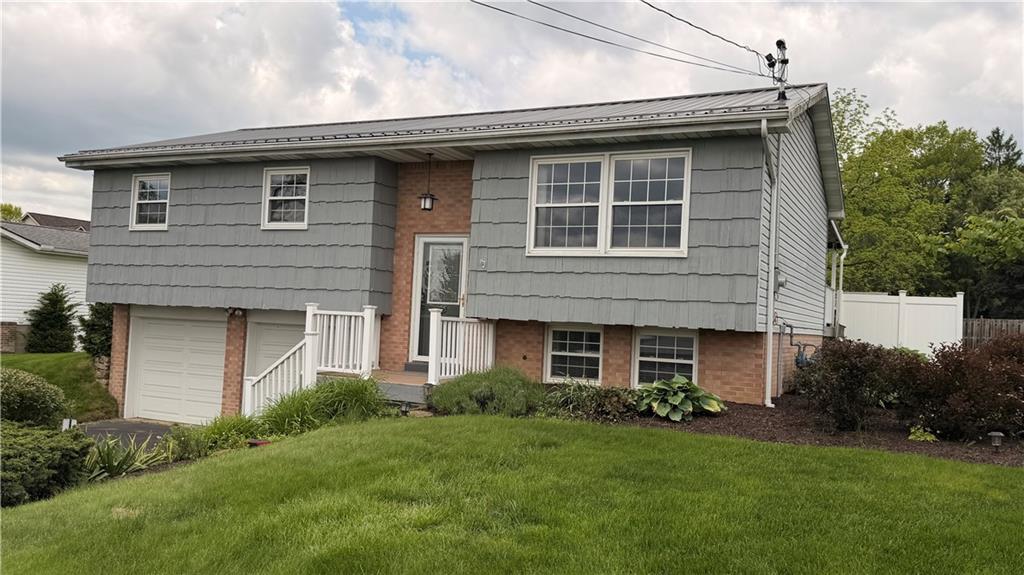 1403 2nd Avenue Beaver, PA 15009 - Photo 1 of 17 a front view of a house with garden