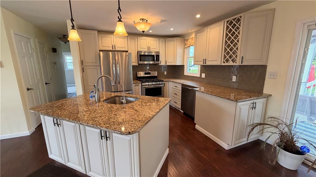 1403 2nd Avenue Beaver, PA 15009 - Photo 5 of 17 a kitchen with kitchen island a sink stove and refrigerator