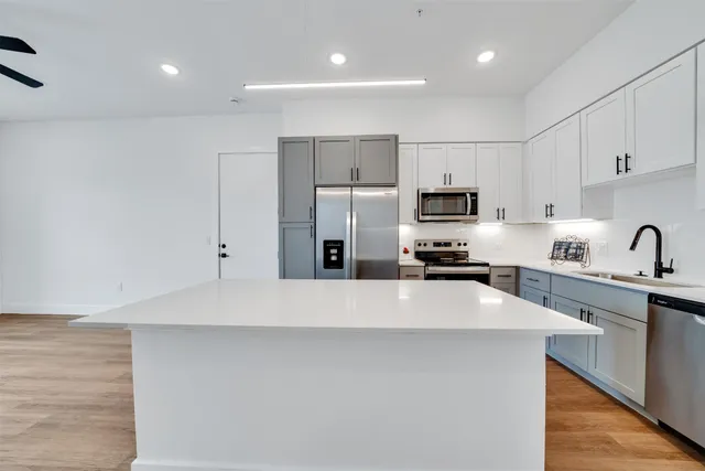 a large kitchen with cabinets