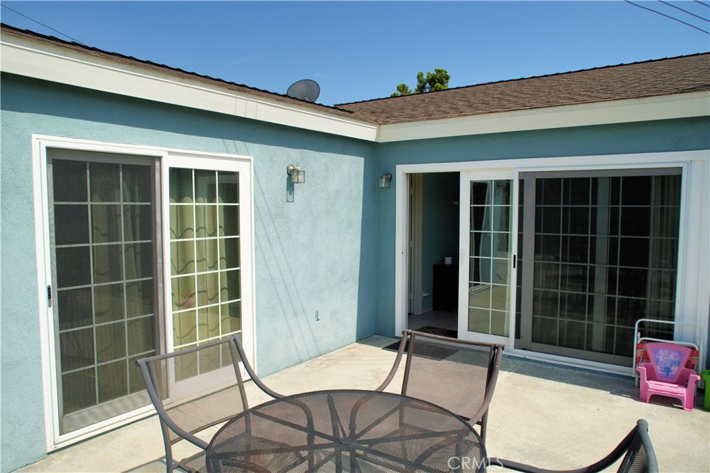 6431 Cathay Circle Buena Park, CA 90620 - Photo 11 of 65 2 backyard doors lead to the paved patio and the grass area,