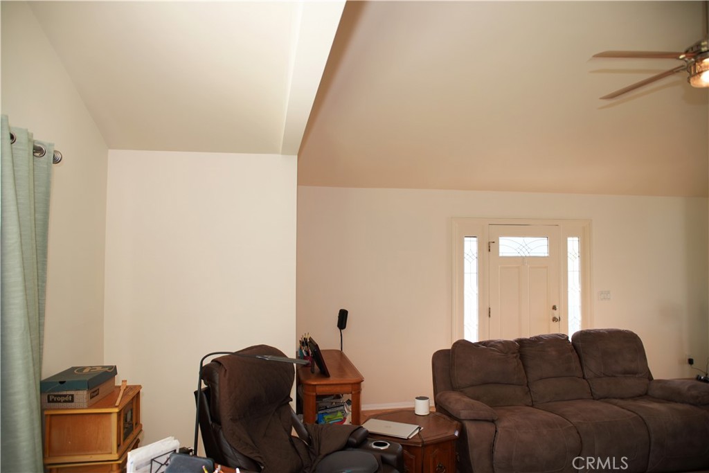 6431 Cathay Circle Buena Park, CA 90620 - Photo 21 of 65 a living room with furniture a couch and a potted plant