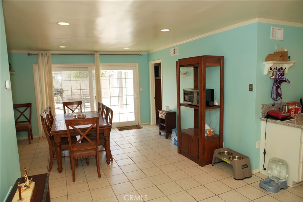 6431 Cathay Circle Buena Park, CA 90620 - Photo 27 of 65 a view of a dining room with furniture and chandelier
