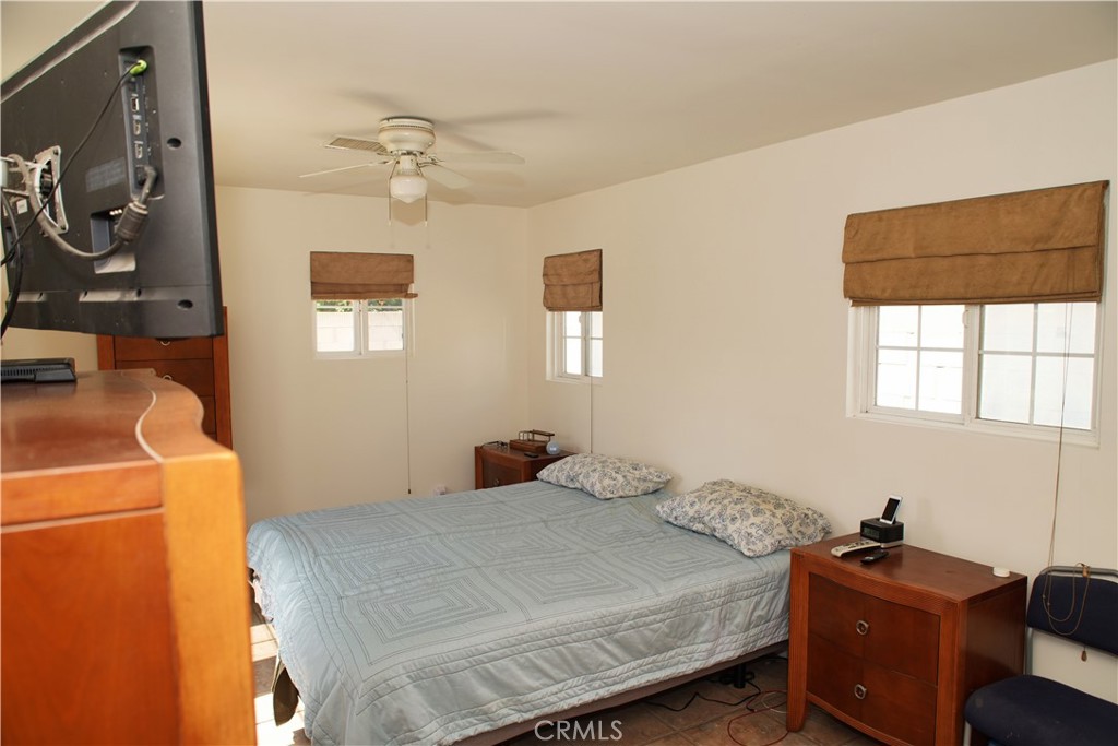 6431 Cathay Circle Buena Park, CA 90620 - Photo 32 of 65 a bedroom with a bed and a window