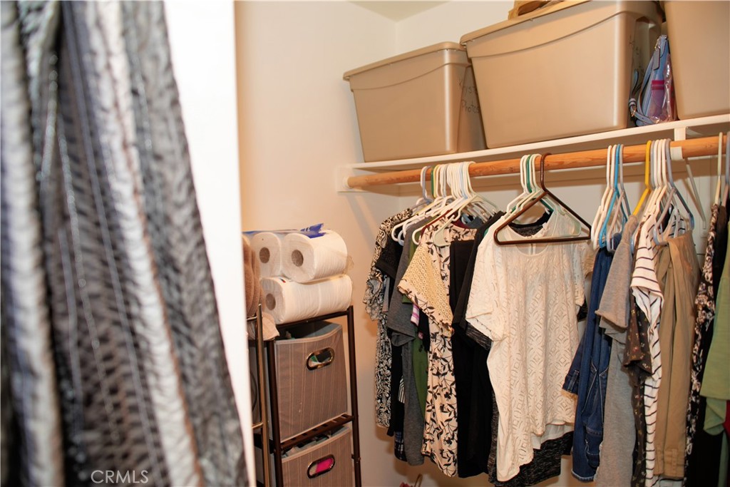 6431 Cathay Circle Buena Park, CA 90620 - Photo 39 of 65 a view of walk in closet with clothes and shoes