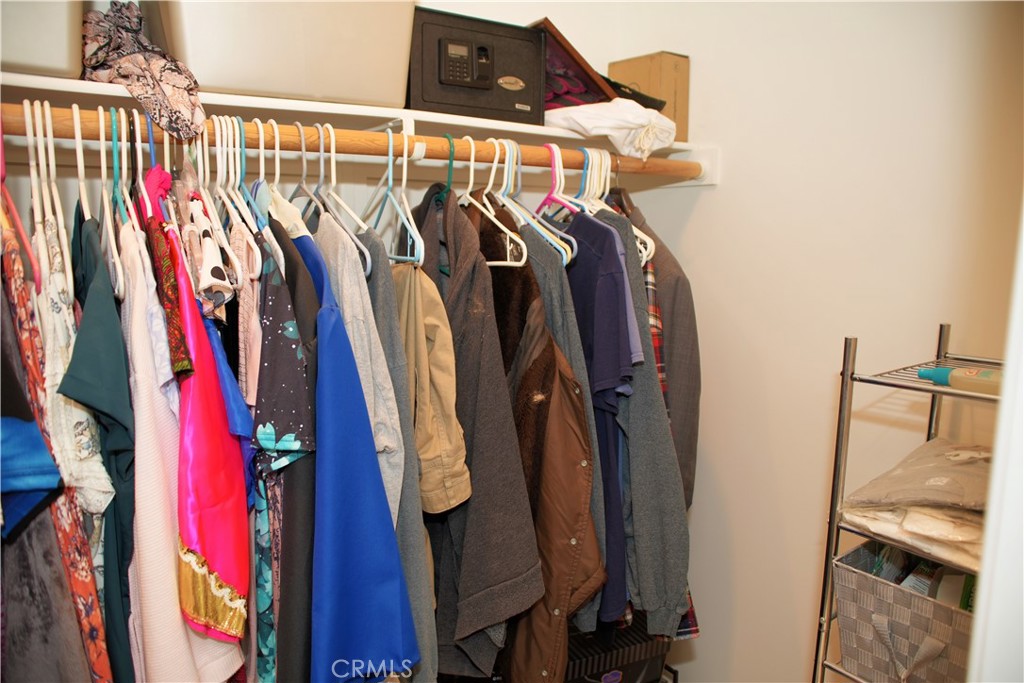 6431 Cathay Circle Buena Park, CA 90620 - Photo 40 of 65 a view of walk in closet with clothes and shoes